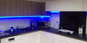 Under-cabinet LED lighting enhances this kitchen