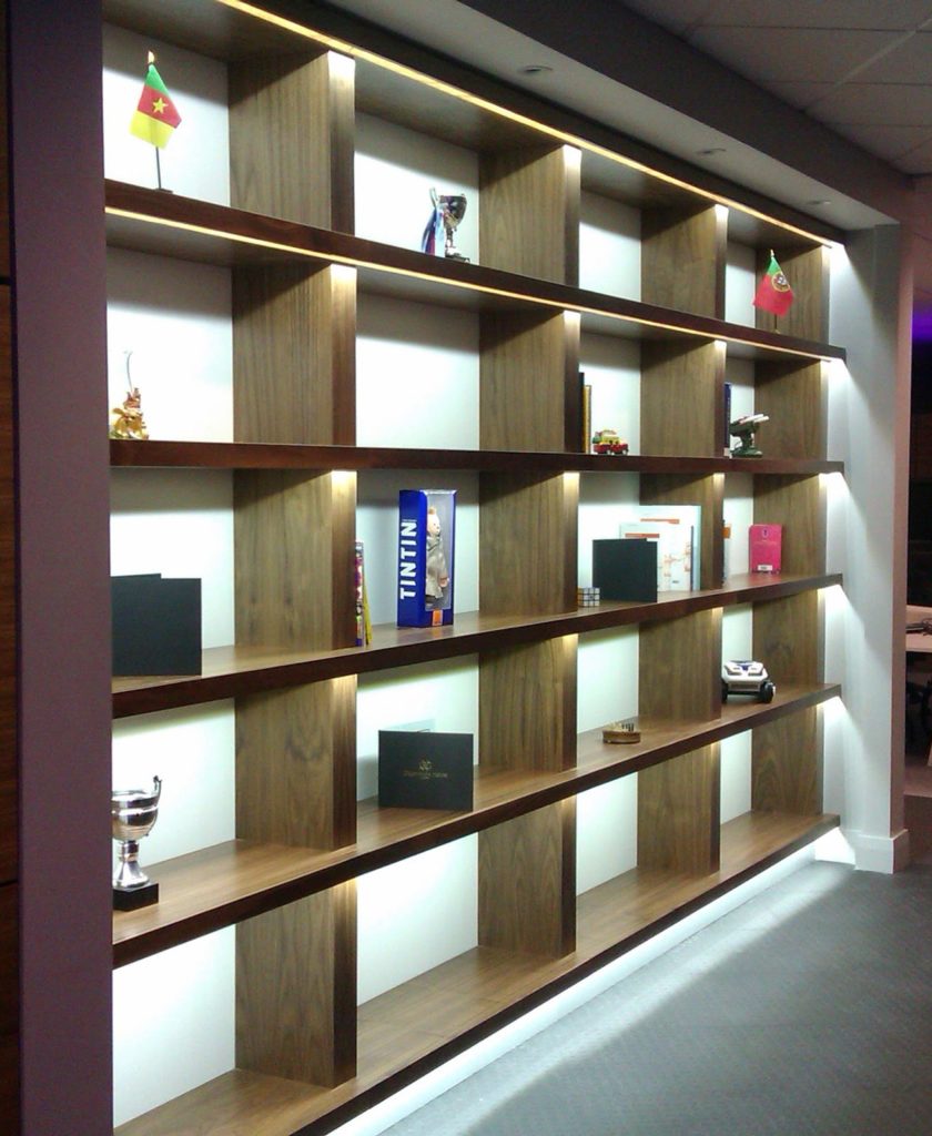 Pure white LED strips light up these shelves