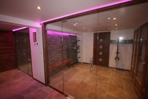 Chalet entrance hall with RGB LEDs showing a plum-coloured light