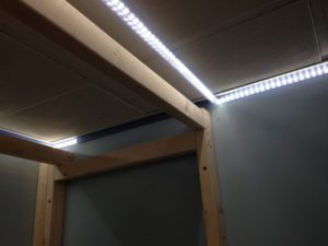 Ceiling perimeter LED strips in the process of being fitted