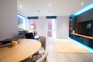 Living room RGBW LED media-panel highlights set to pastel blue