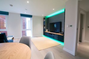 Living room RGBW LED media-panel highlights set to pastel green