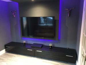 The finished cinema room, with TV media panel - view 1