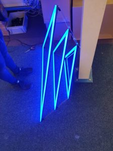 10-watt blue LED strips being fitted to the triangular frames