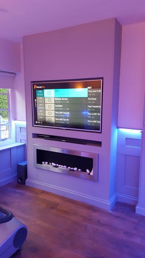 Tv on the wall with LED Tape in the Alcoves