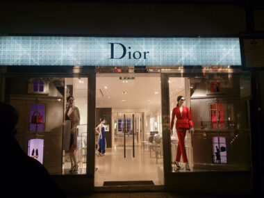 Outside of Dior Christmas shop window display at night