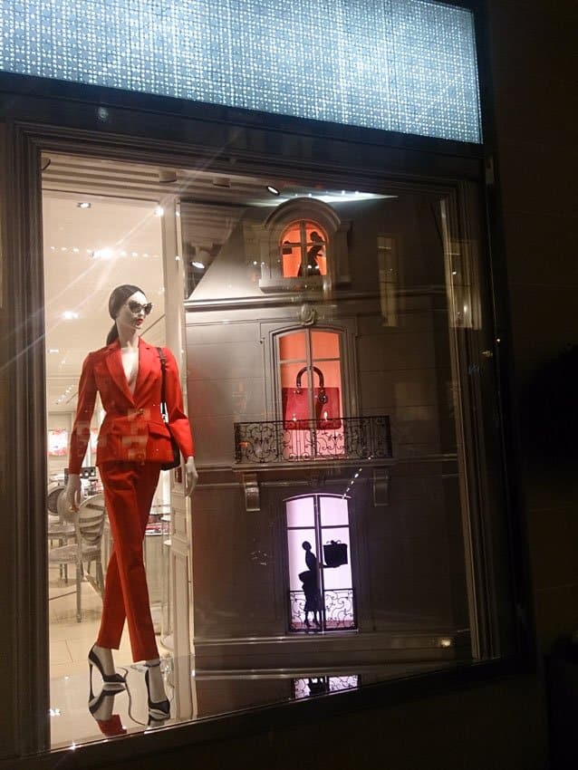 corner of Dior Christmas shop window display at night